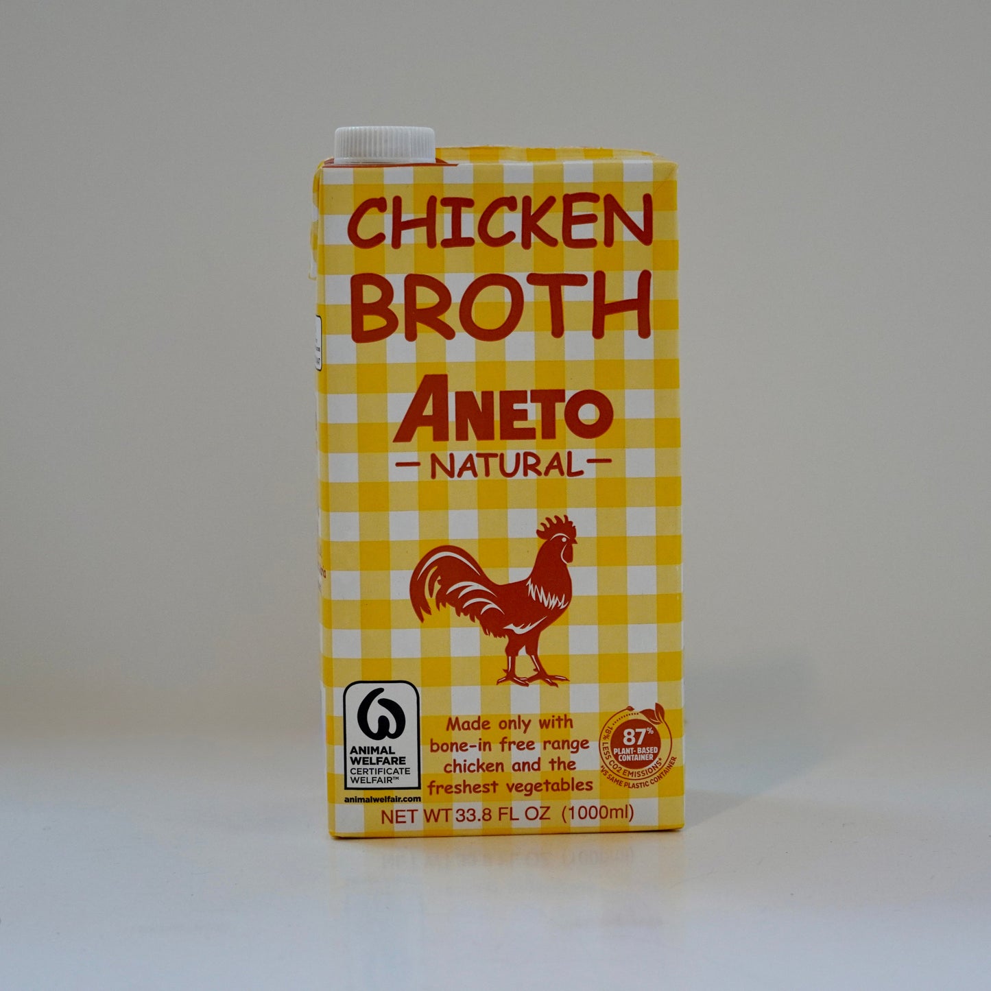 Carton of Aneto Chicken Broth on a white background