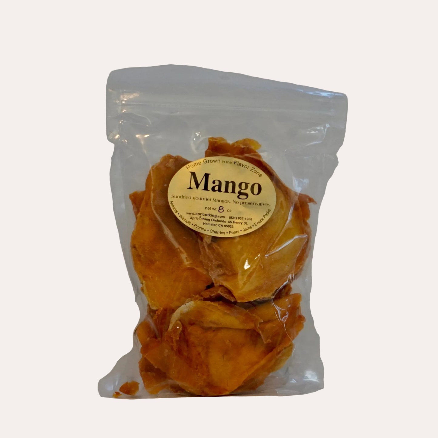 Packaged mangoes with a label on a white background