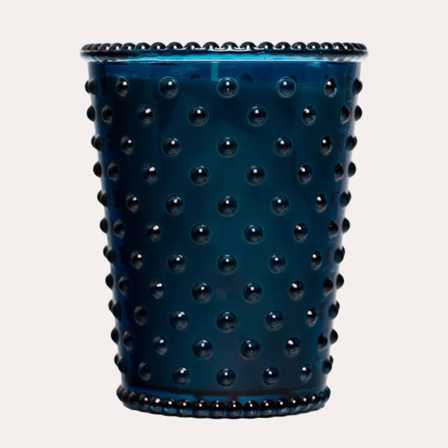 Blue textured candle holder on a white background