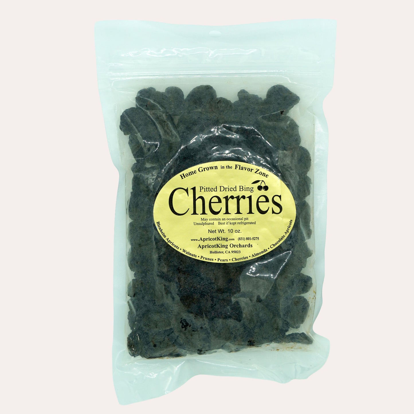 Packaged cherries with a label on a white background