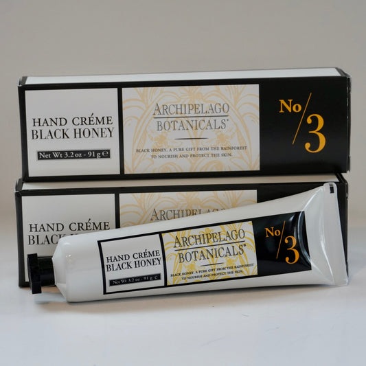 Archipelago Botanicals Hand Crème Black Honey with packaging on a light gray background