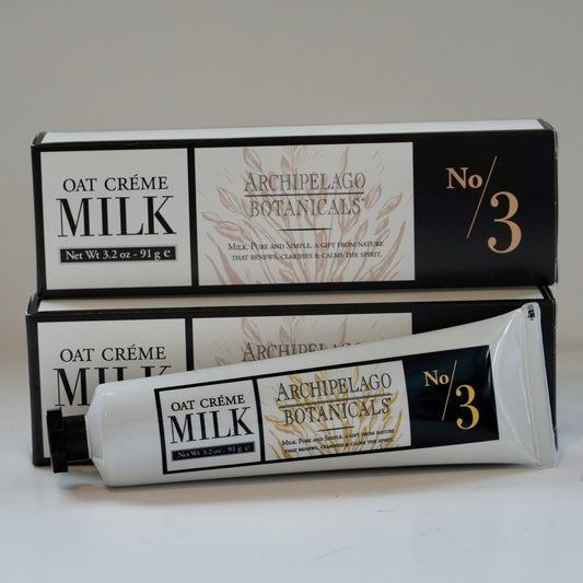 Oat Crème Milk tube and packaging of Archipelago Botanicals on a white background