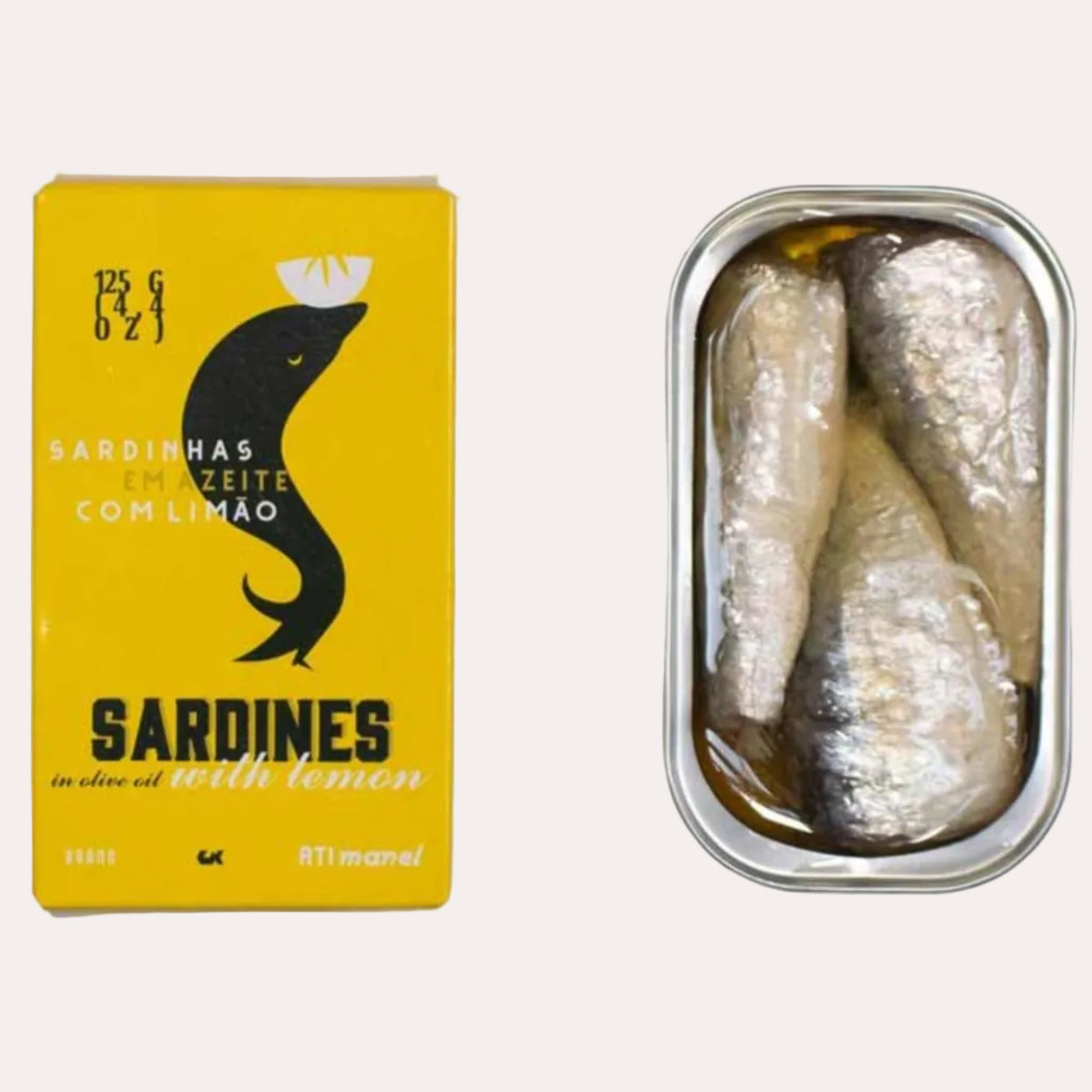 A tin of sardines with lemon in olive oil shown next to its yellow packaging box on a white background.