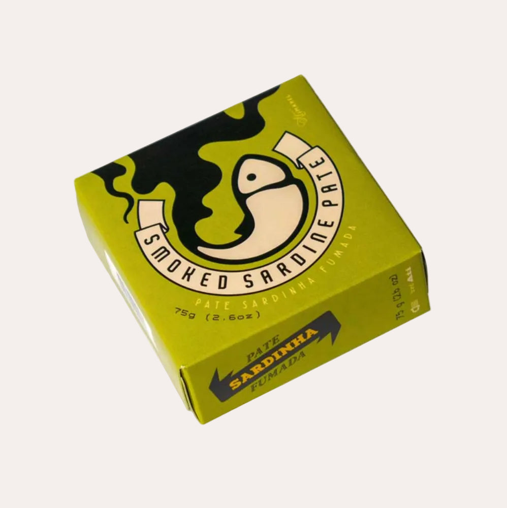 Box of smoked sardine pate with a yellow and black design on a white background
