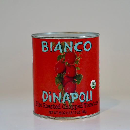 Can of Bianco DiNapoli fire roasted chopped tomatoes on a white background