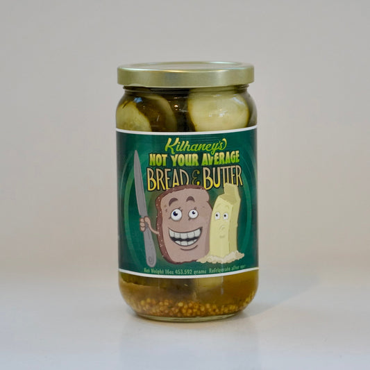 Jar of bread and butter pickles with a humorous label on a white background