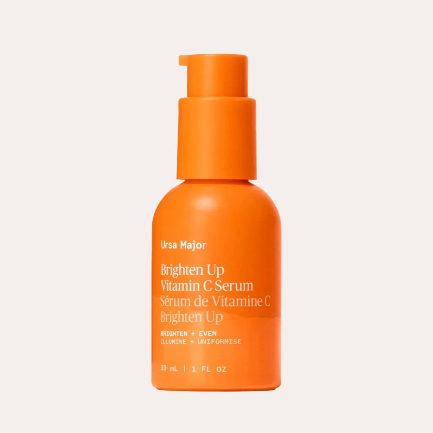 Orange bottle of Ursa Major Vitamin C Serum on a white background