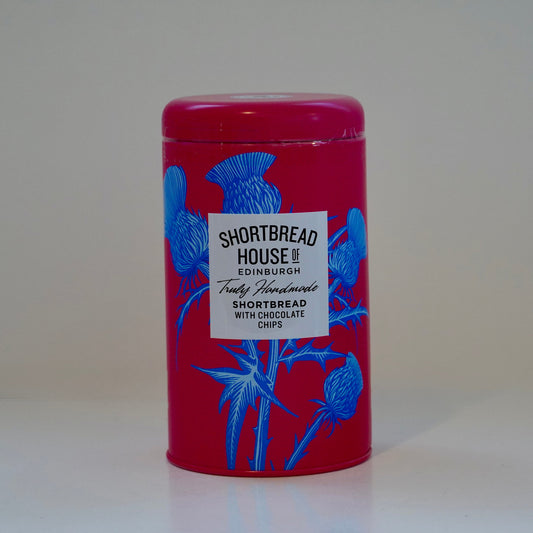 Red tin with blue floral designs and a label on a white background