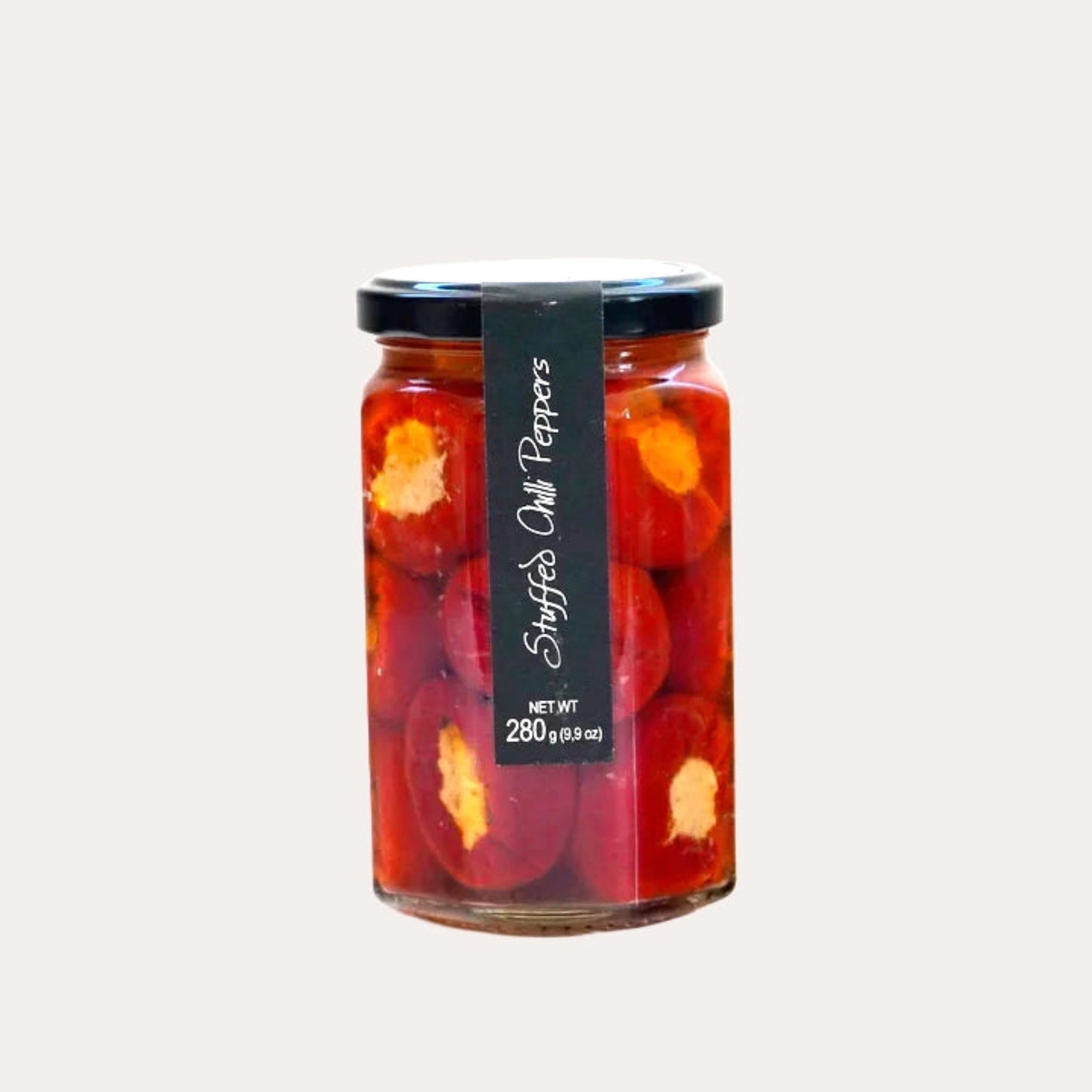 Jar of stuffed chili peppers with a black label on a white background