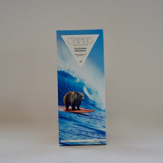 Compartes chocolate bar packaging with a bear on a surfboard design on a white background