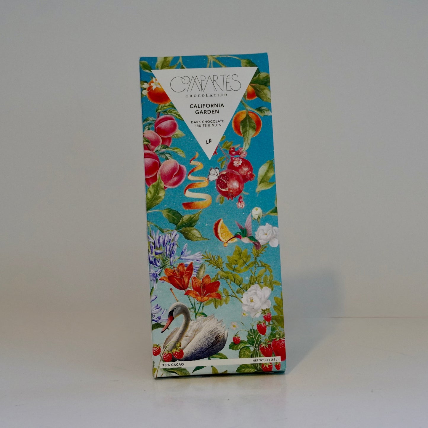 Decorative box with floral and bird design on a white background