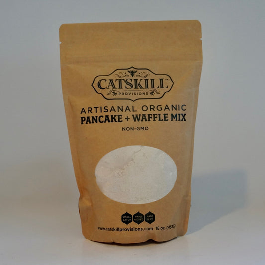 Kraft paper packaging of Catskill Artisanal Organic Pancake + Waffle Mix on a white background