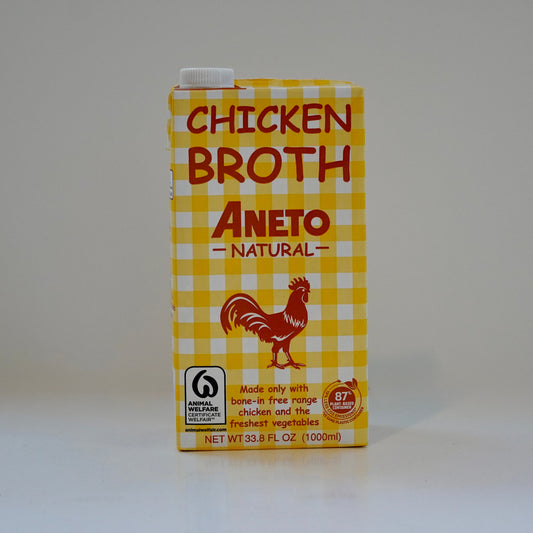 Carton of Aneto Chicken Broth on a white background