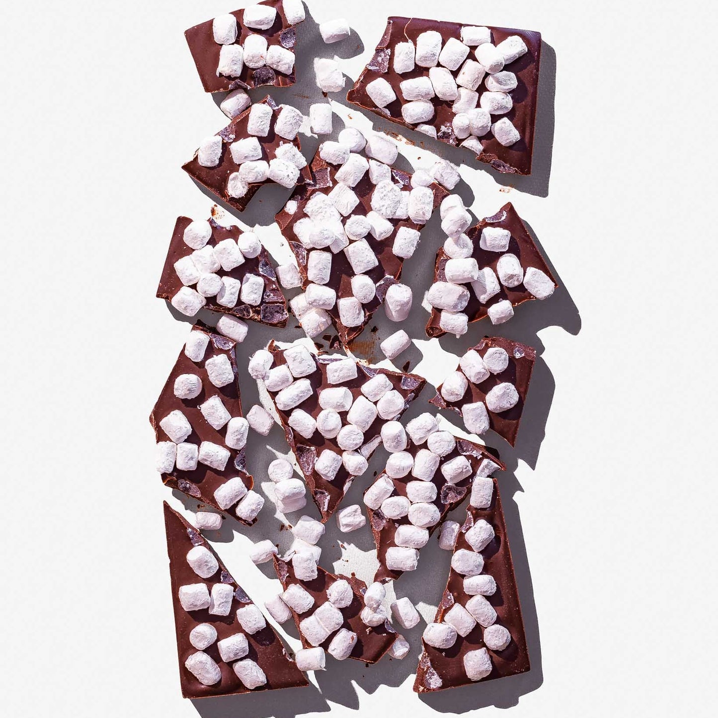 Chocolate bars with marshmallows on a white background