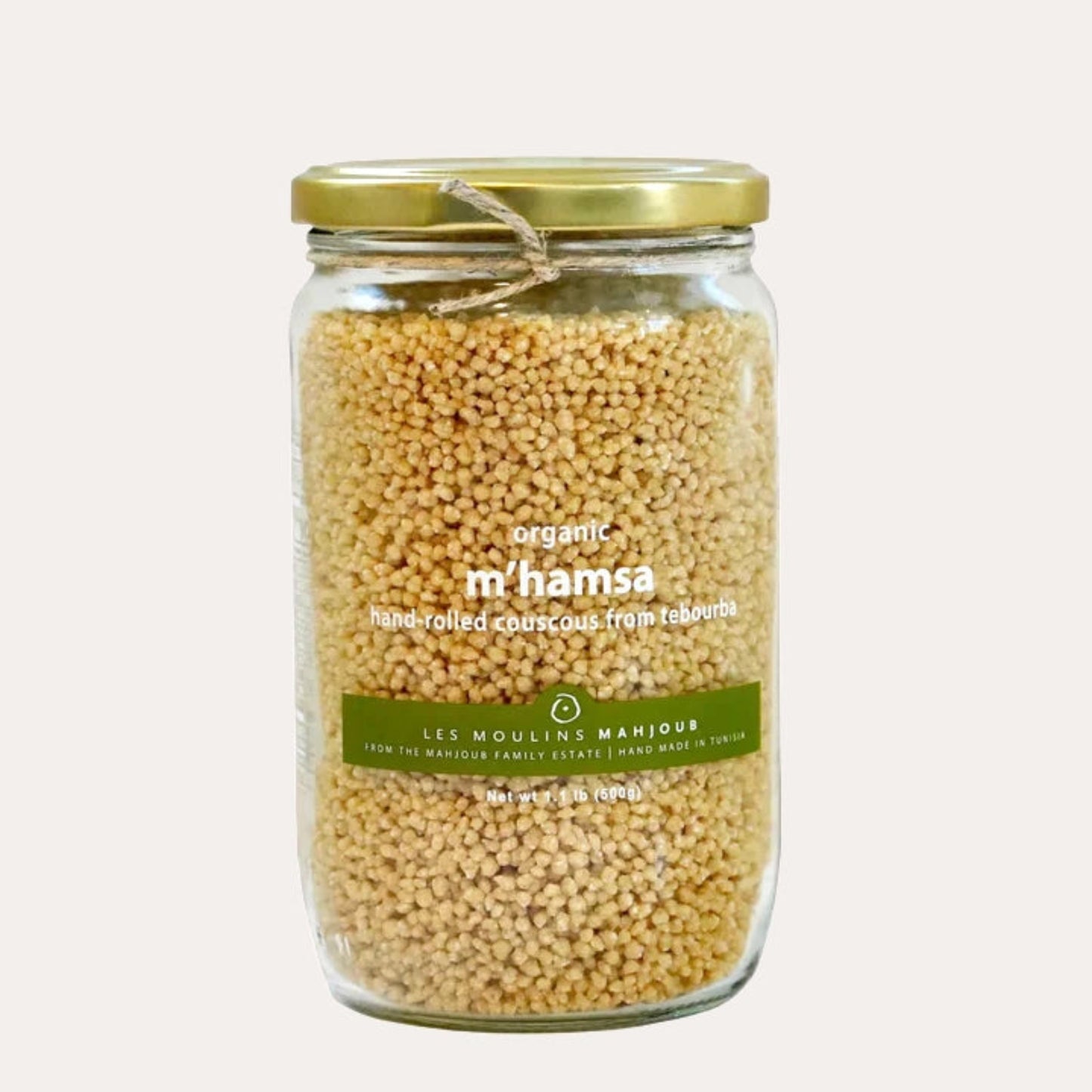 Jar of organic m'hamsa couscous with a gold lid on a white background
Cork Market shipping gourmet provisions across the USA