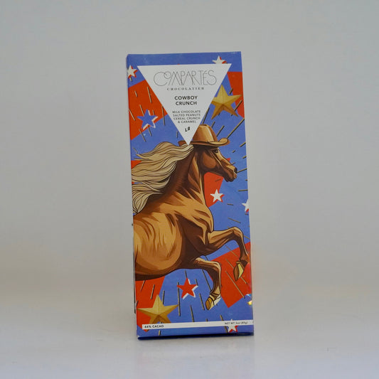 Box with a graphic of a cowboy on a horse against a blue background