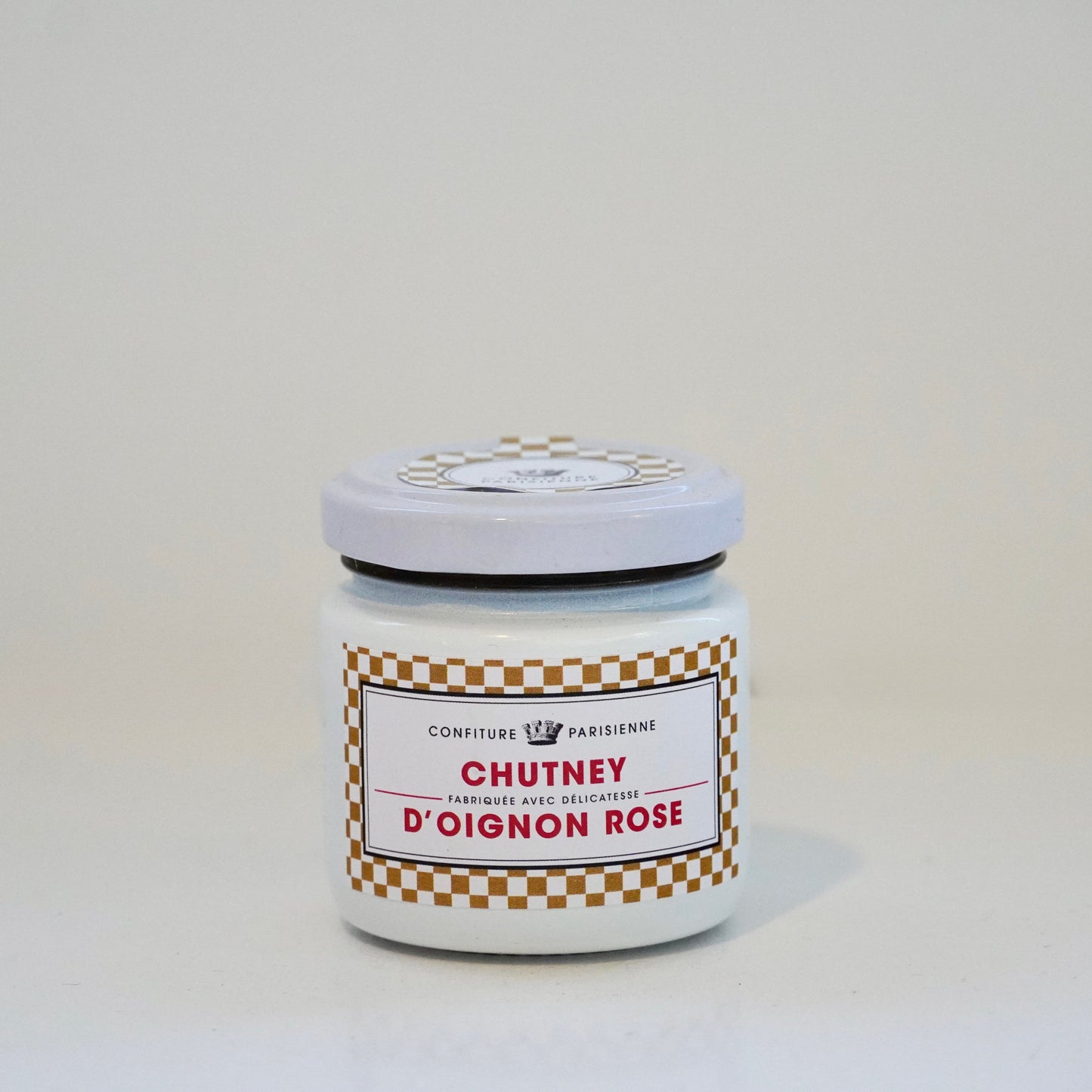 Jar of chutney with a label on a white background