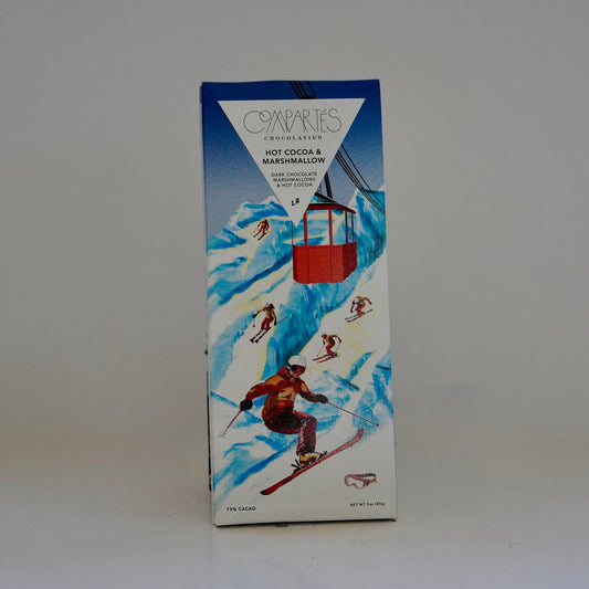 Box of Capaics hot cocoa with skiing design on a white background