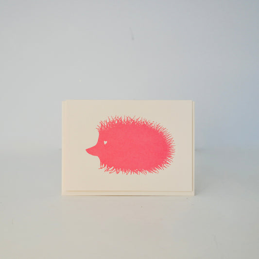 Note card with a red hedgehog illustration on a light gray background