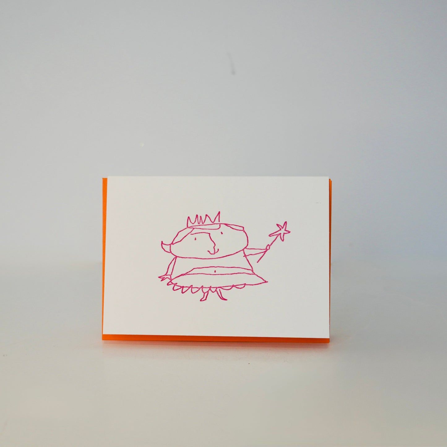 Card with a red drawing of a character on a white background