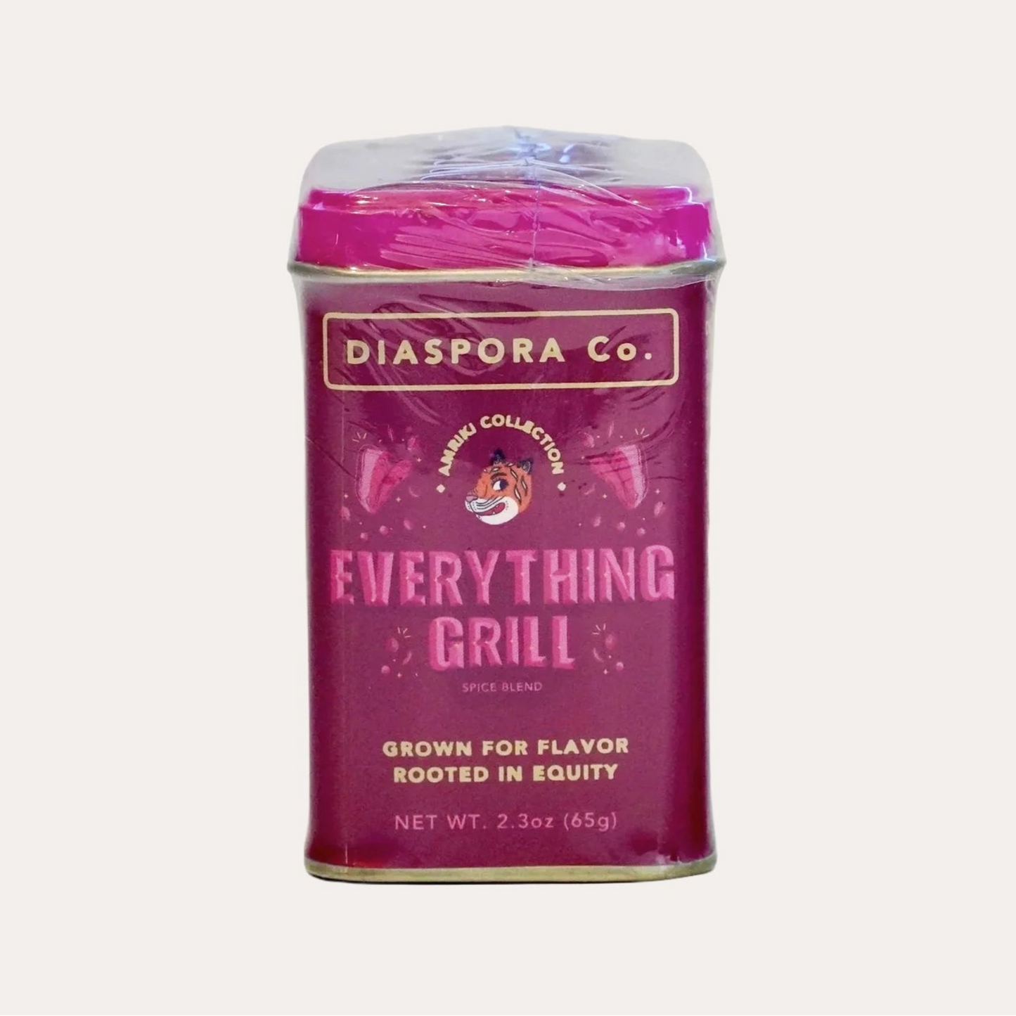 Pink canister labeled 'Diaspora Co. Everything Grill' on a white background