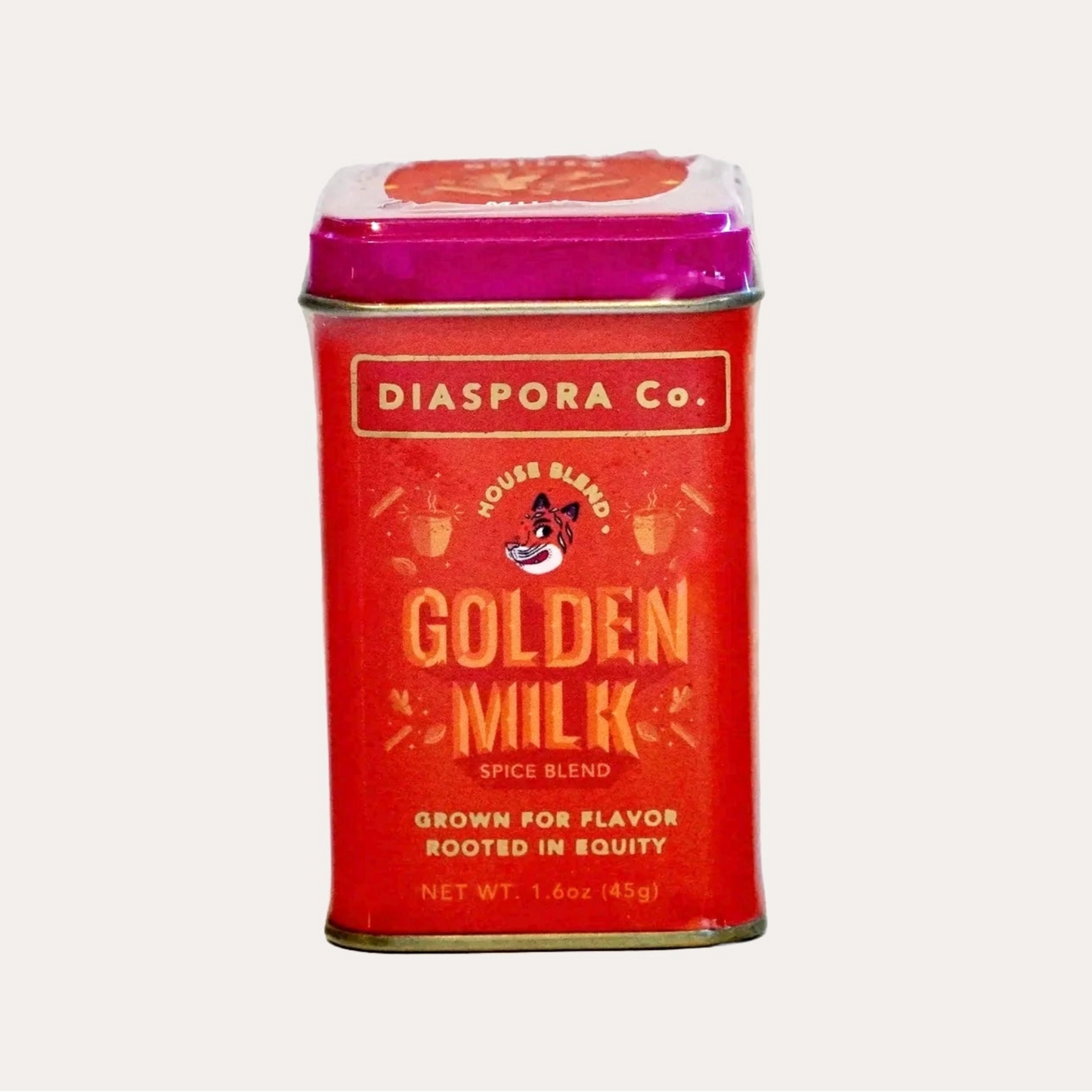 Red canister of Diaspora Co. Golden Milk on a white background