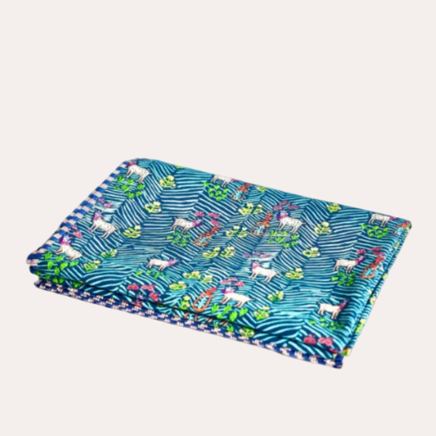 Folded fabric with unicorn pattern on a white background