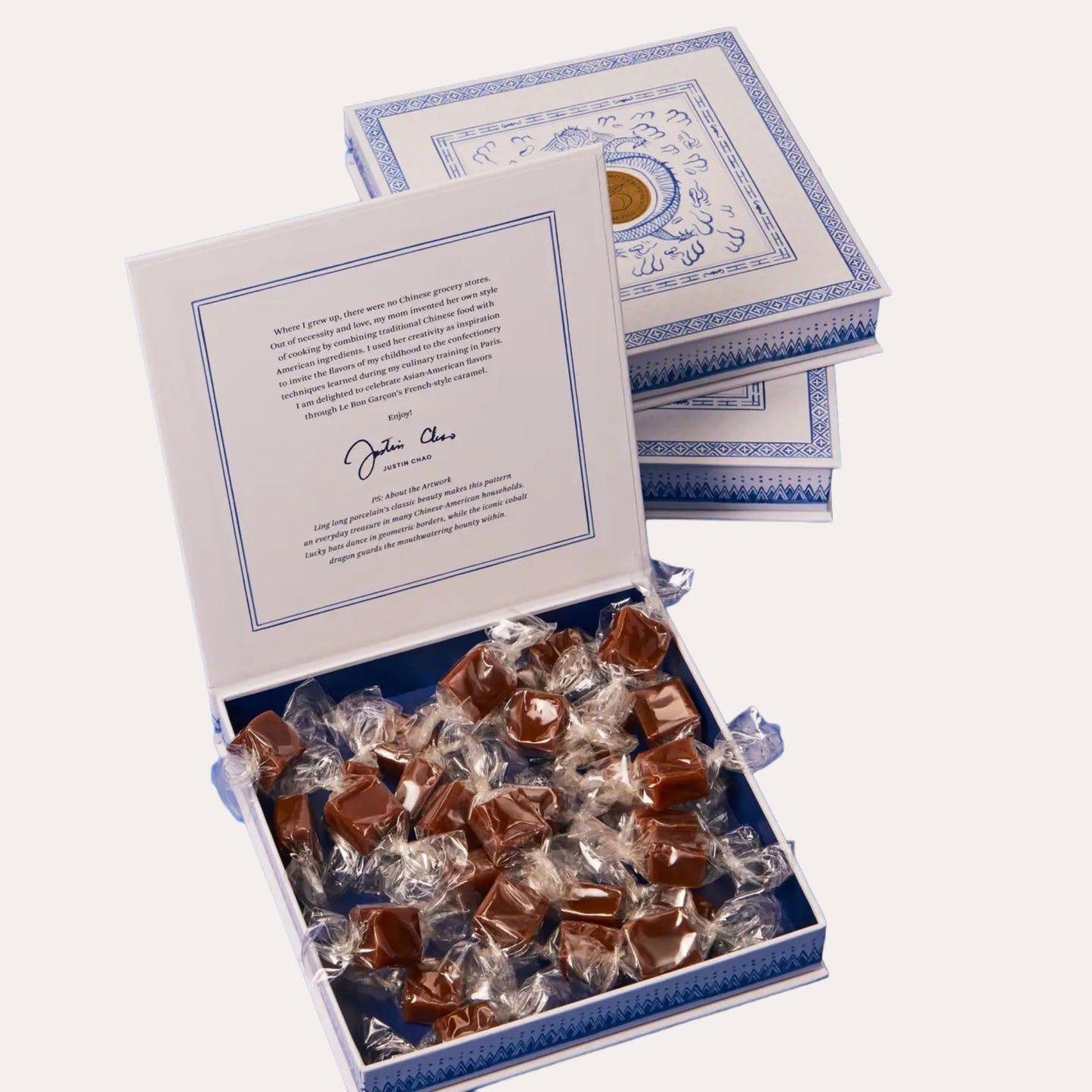 Box of chocolates with a letter inside on a white background