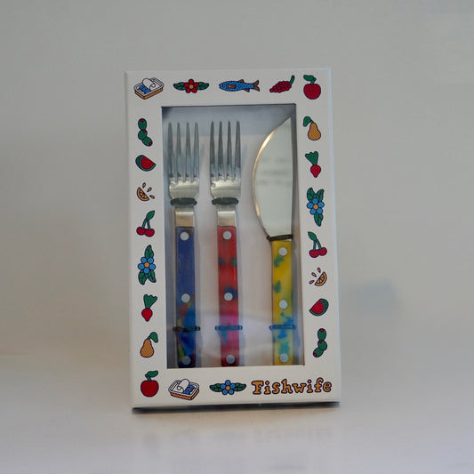 Set of colorful cutlery in a decorative box with 'Fishwife' branding.