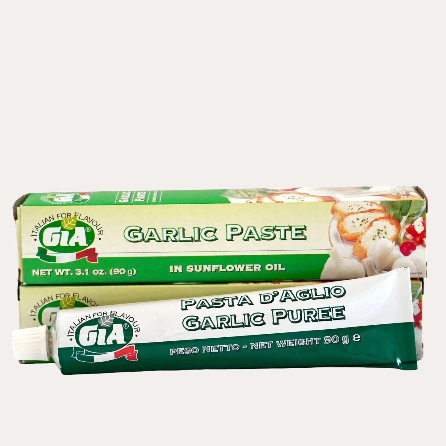 Two tubes of GIA Garlic Paste on a white background
