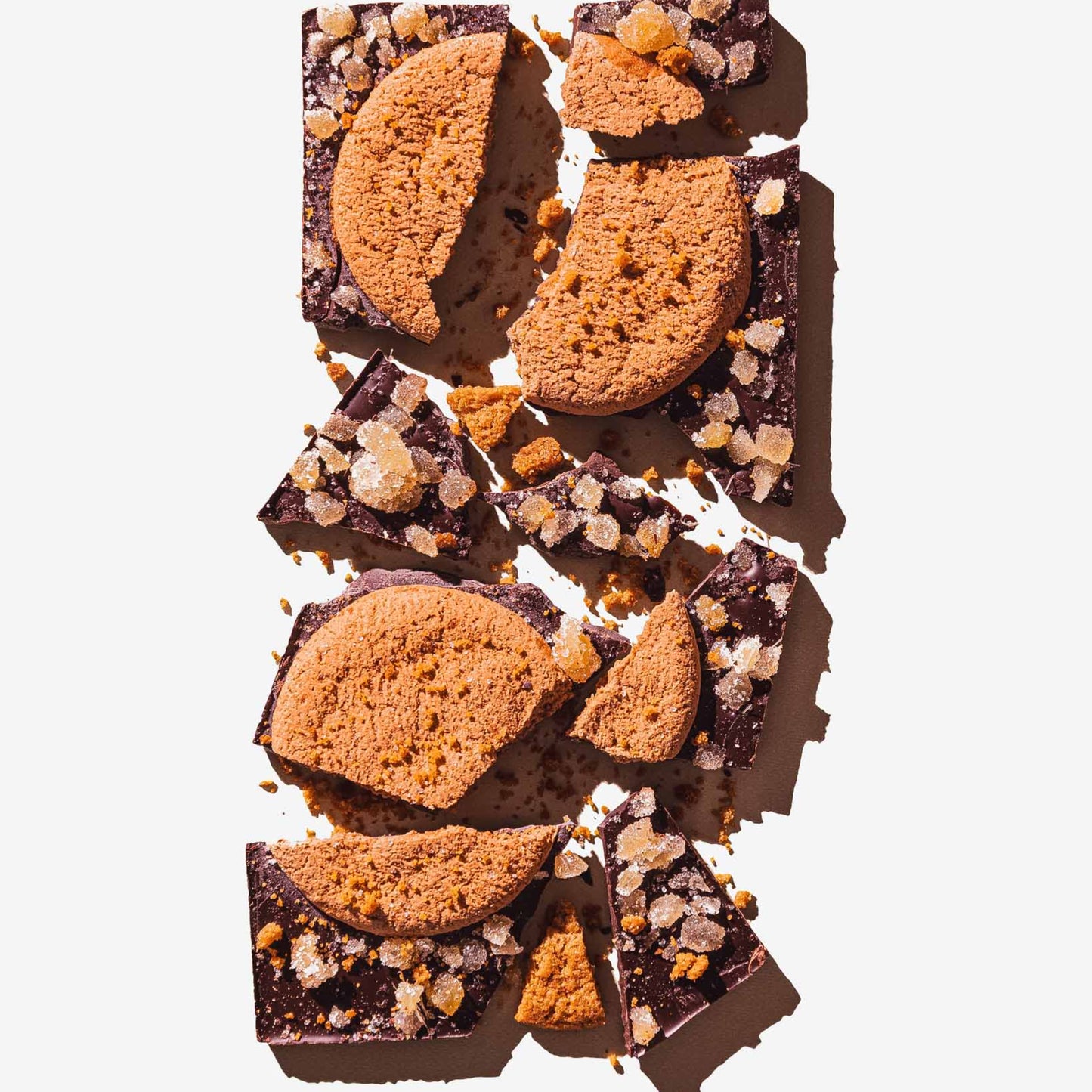 Chocolate bars with cookie pieces on a white background