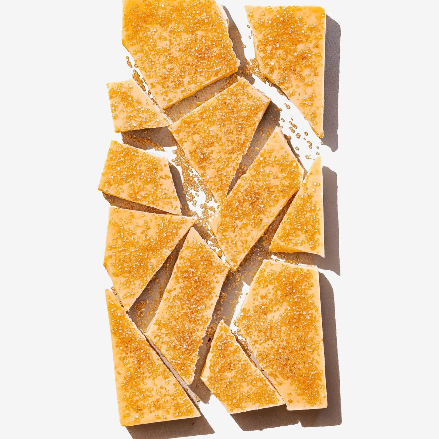 Crystallized sugar and chocolate pieces on a white background