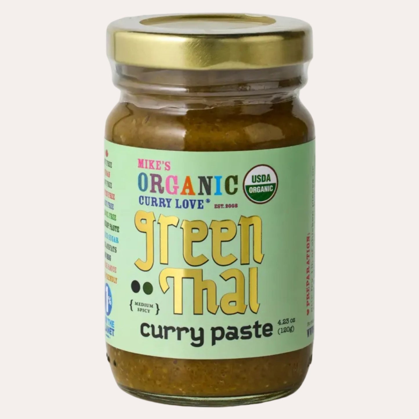 Jar of Mike's Organic Green Thai Curry Paste on a white background