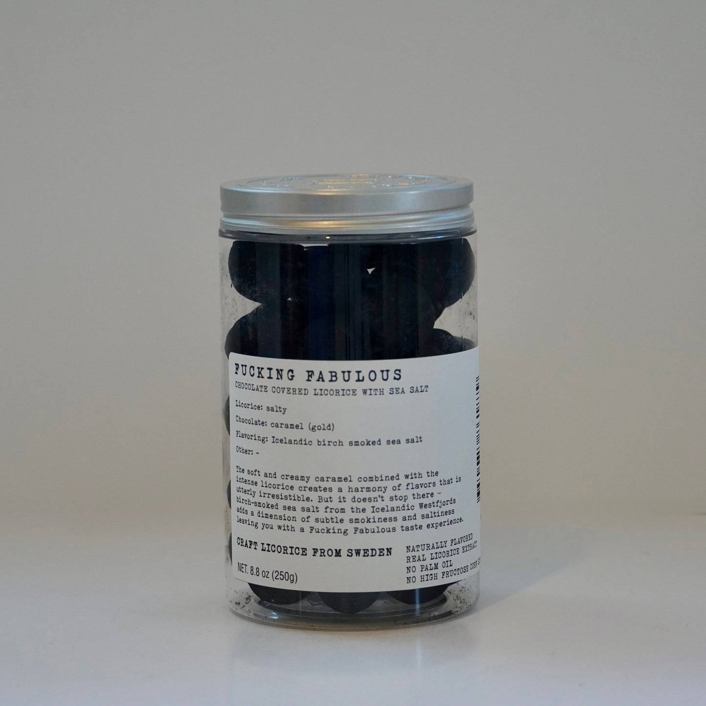Jar of black leathers with a label on a white background