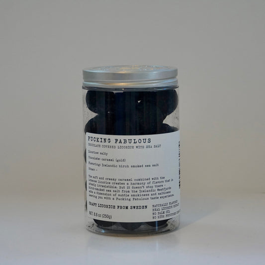 Jar of black leathers with a label on a white background