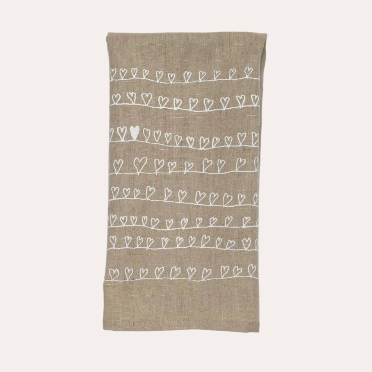 Beige towel with white heart patterns on a white background
handmade in Vermont
ships nationwide
