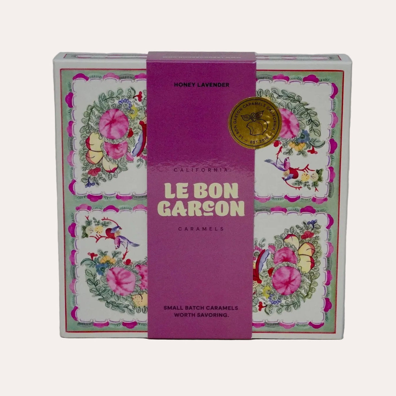 Product packaging with floral design and 'Le Bon Garcon' branding on a white background