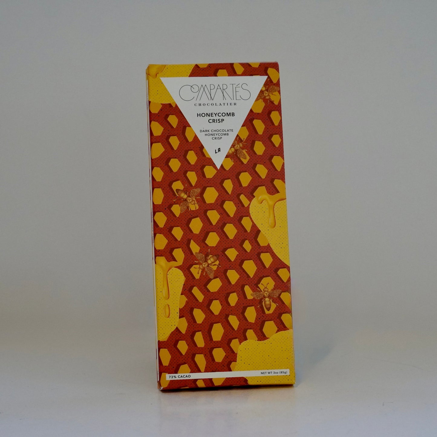Chocolate bar with honeycomb design on a white background