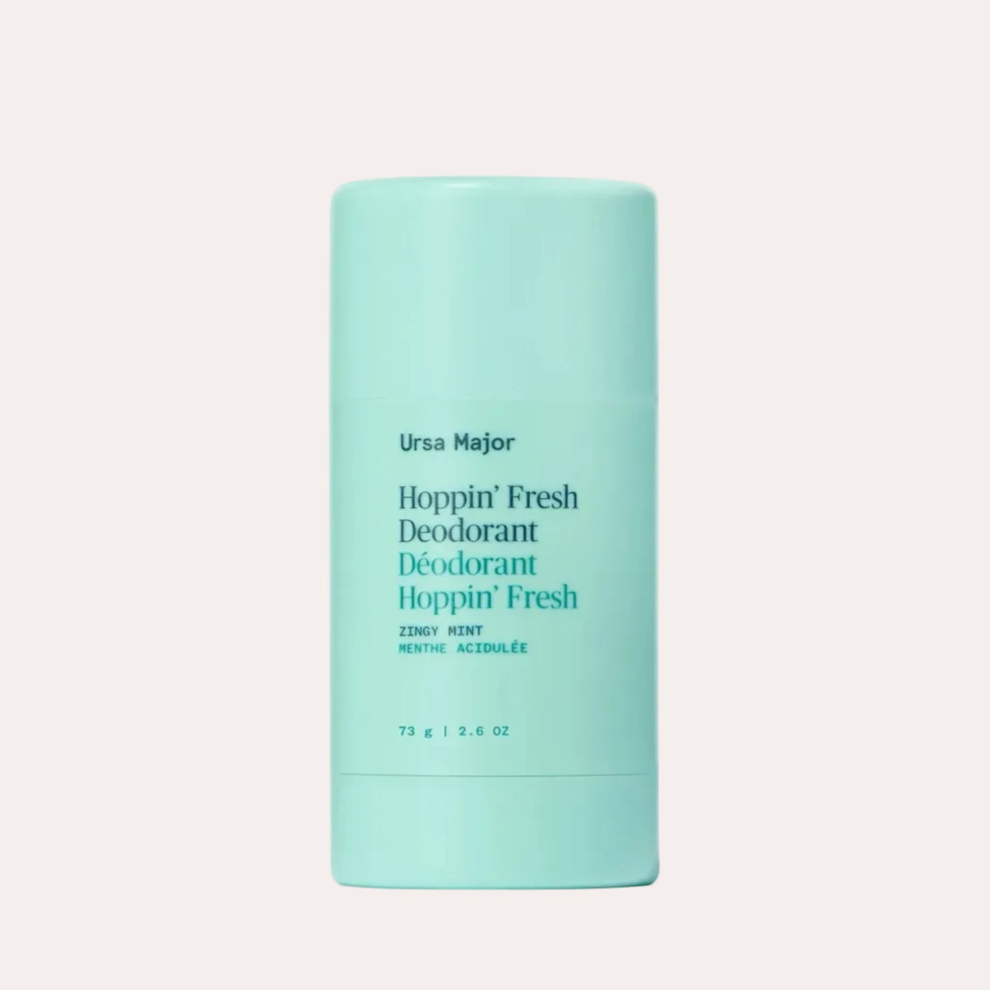 Mint green deodorant stick with text on a white background