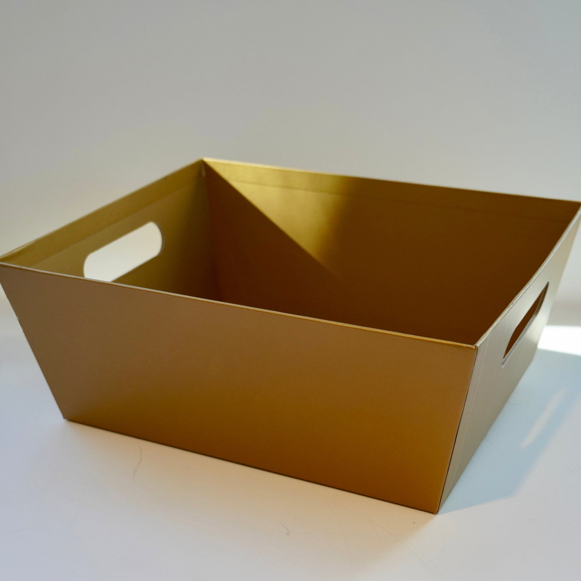 Gold metallic tray on a white background