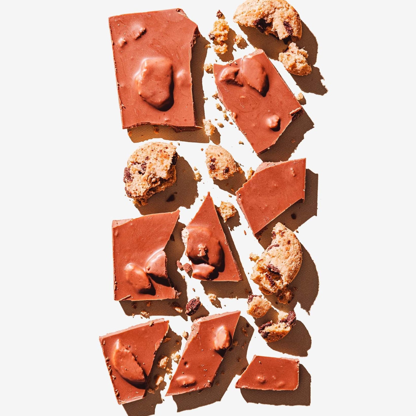 Chocolate bars with cookie pieces on a white background