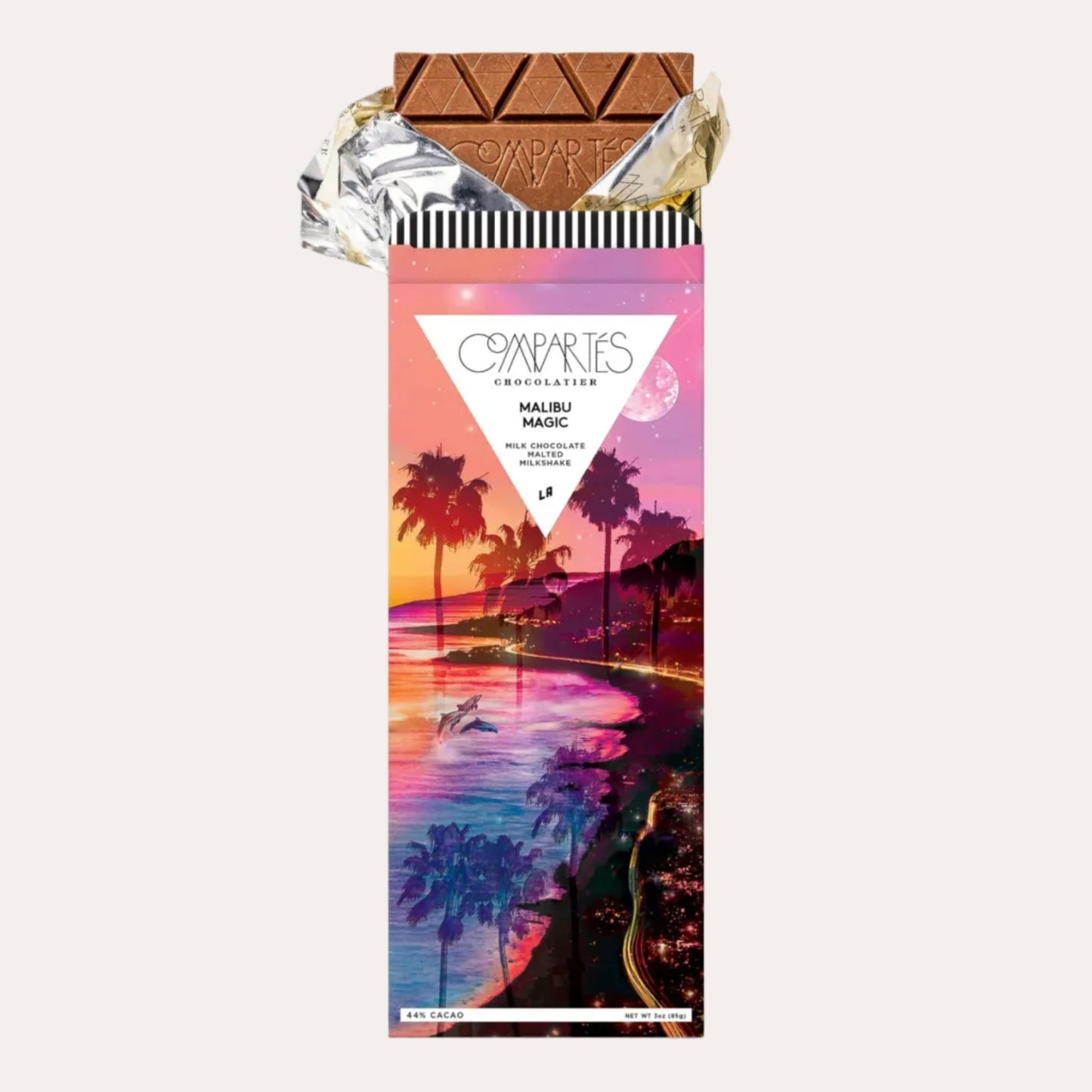 Chocolate bar with a colorful packaging featuring palm trees and a beach scene on a white background.