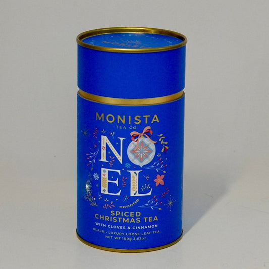 Blue tea canister with gold rim on a white background