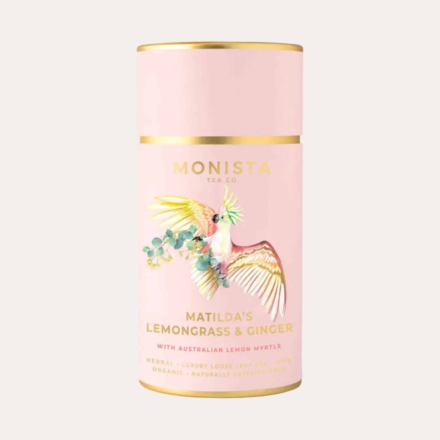 Pink tea canister with gold accents and bird illustration on a white background