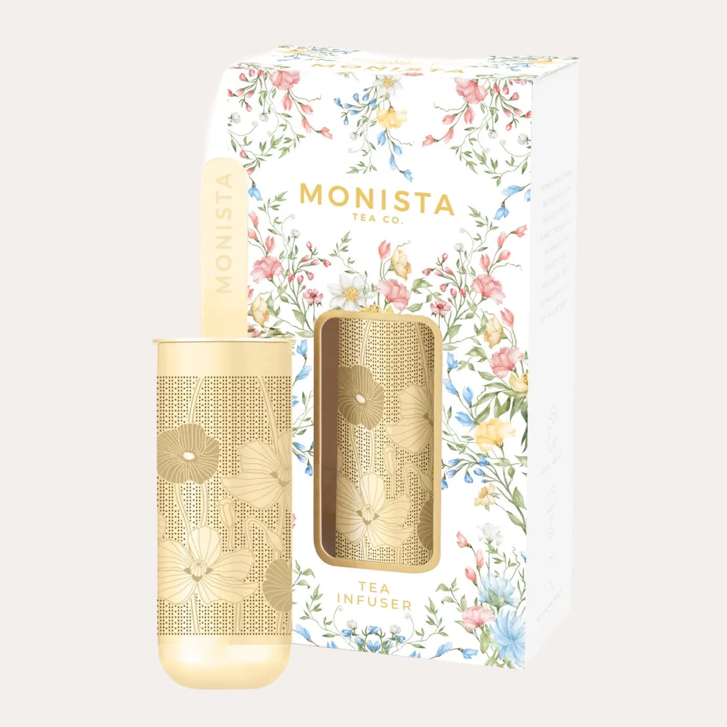 Gold tea infuser with floral packaging featuring the brand 'Monista'.