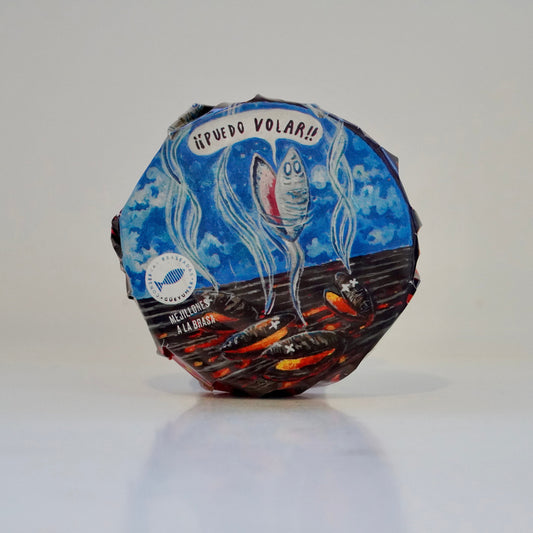 Round fish product with blue label on a white background