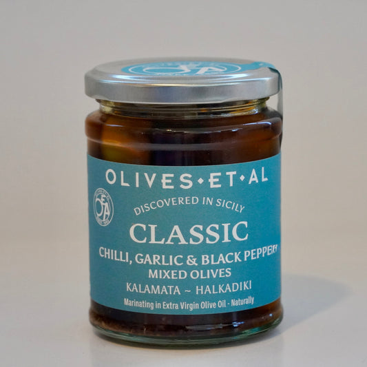 Jar of olives with a blue label on a white background