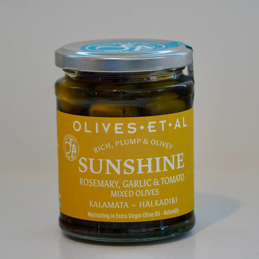 Jar of 'Sunshine' olives with a yellow label on a white background