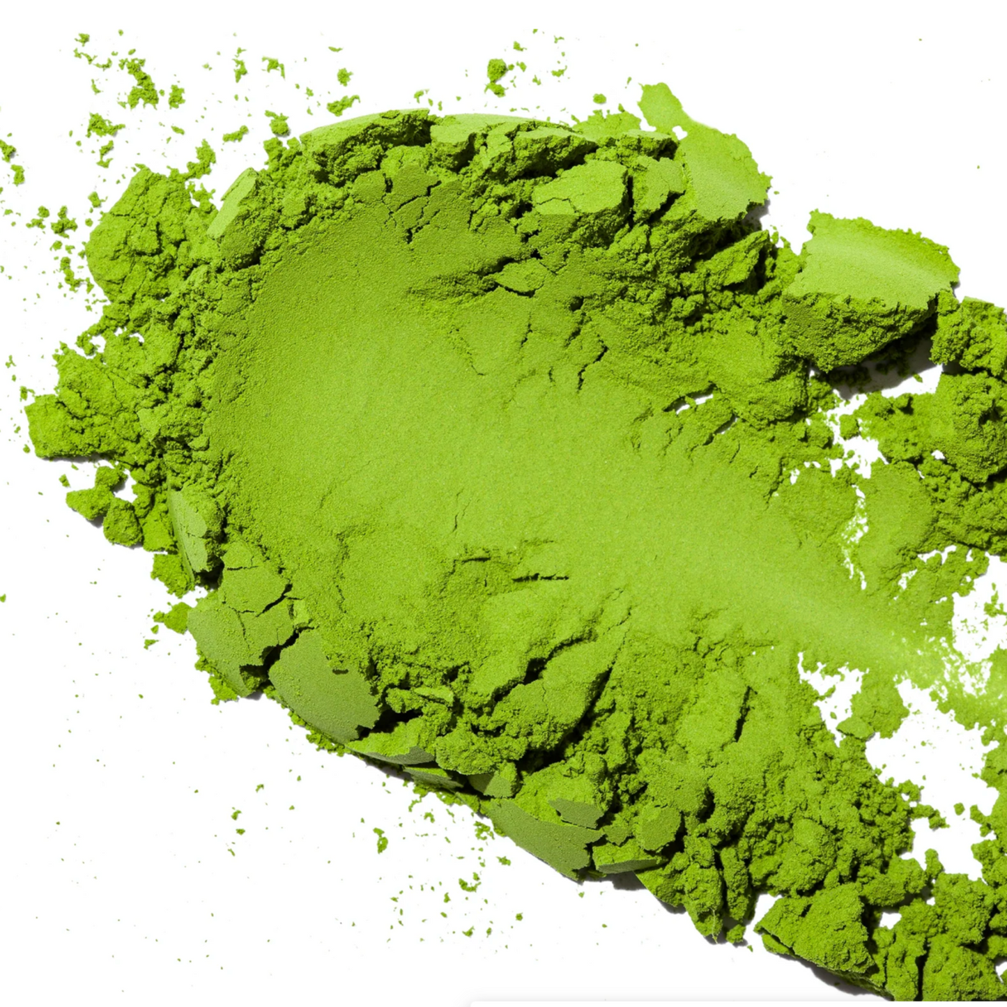 Green matcha powder on a white background