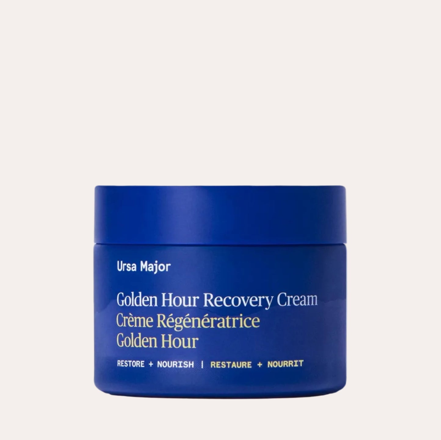 Blue jar of Ursa Major Golden Hour Recovery Cream on a white background